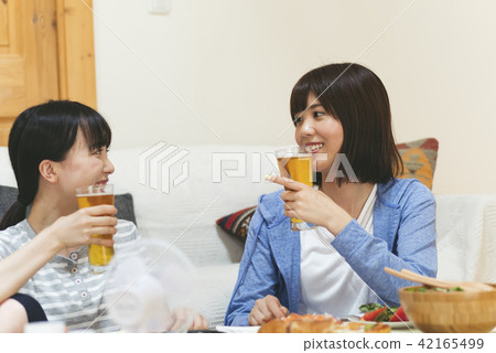 A woman drinking at home 42165499