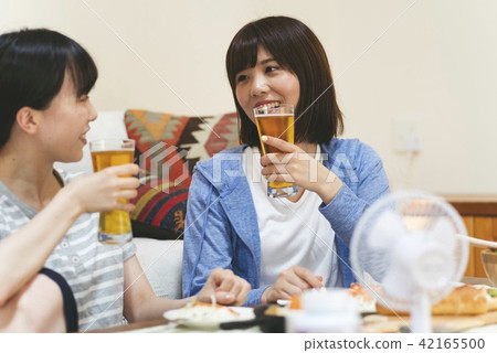 A woman drinking at home 42165500