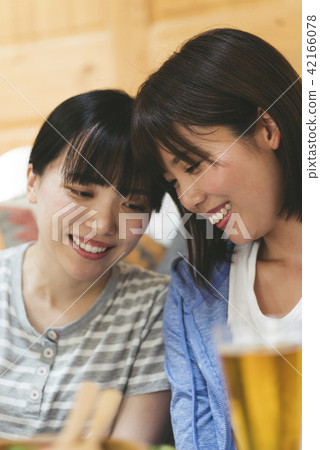 A woman drinking at home 42166078