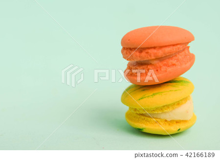 Stack of colorful macaroons on green colour Stack of colorful macaroons on green colour 42166189