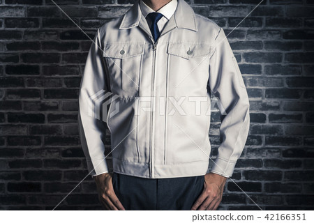 Work clothes men and brick background 42166351