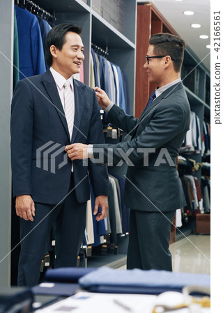 Trying on bespoke suit 42166561