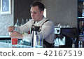 Bartender making alcohol coctail in restaurant 42167519