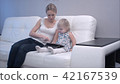 Mother and baby using digital tablet 42167539