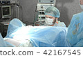 Medical team performing operation in hospital 42167545