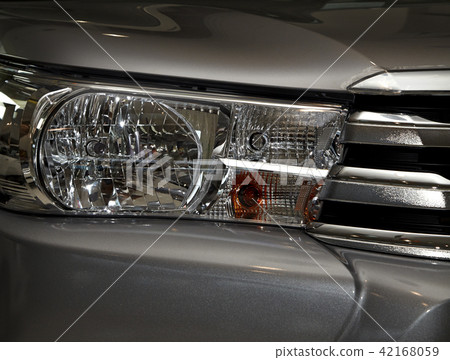 Closeup headlights of car. Closeup headlights of car. 42168059
