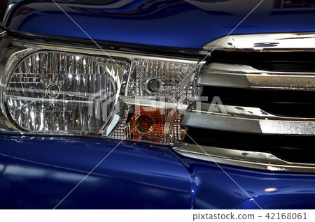 Closeup headlights of car. Closeup headlights of car. 42168061