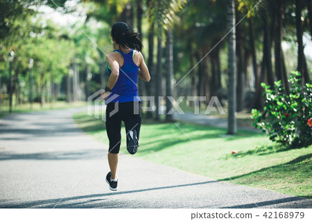 fitness woman runner running on the forest trail 42168979
