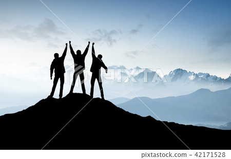 Silhouettes of team on mountain peak. Silhouettes of team on mountain peak. 42171528