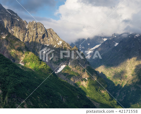 Sunset in the mountain valley. 42171558