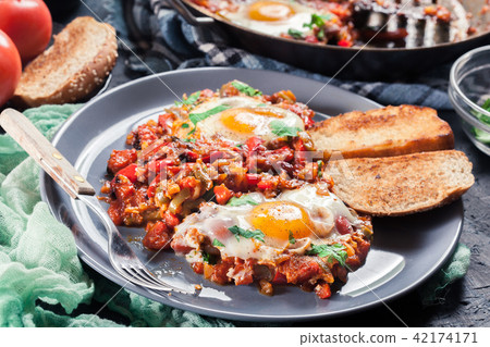 Portion of shakshuka on a plate Portion of shakshuka on a plate 42174171