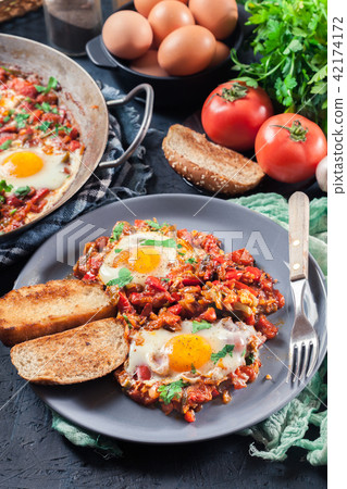 Portion of shakshuka on a plate Portion of shakshuka on a plate 42174172