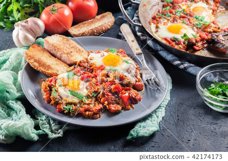 Portion of shakshuka on a plate Portion of shakshuka on a plate 42174173