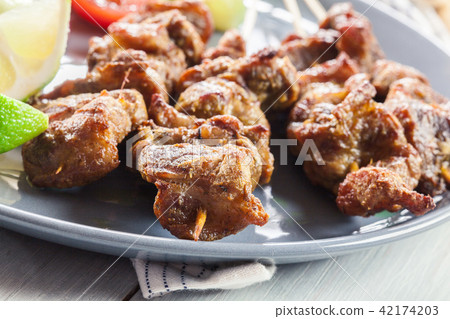 Pork satay with peanut sauce and vegetables 42174203