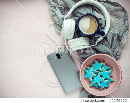 Telephone, headphones, a cup of fragrant cappuccino 42176362