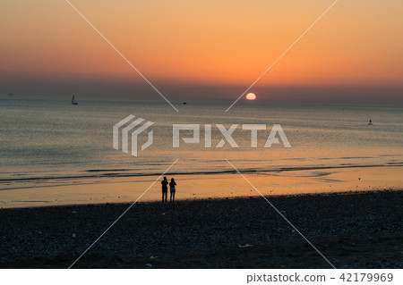 Sunset at the beach with romantic couple Sunset at the beach with romantic couple 42179969