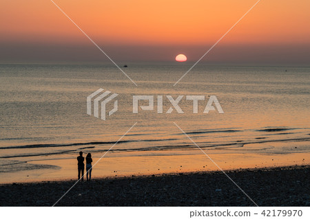Sunset at the beach with romantic couple 42179970