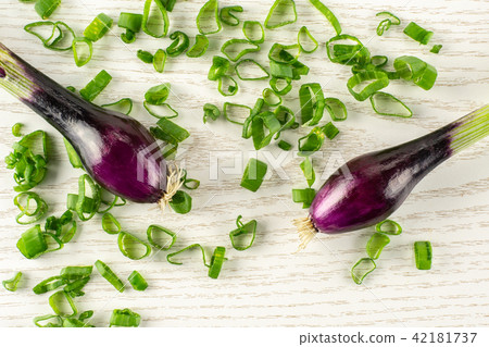 Fresh Raw green spring onion on grey wood Fresh Raw green spring onion on grey wood 42181737