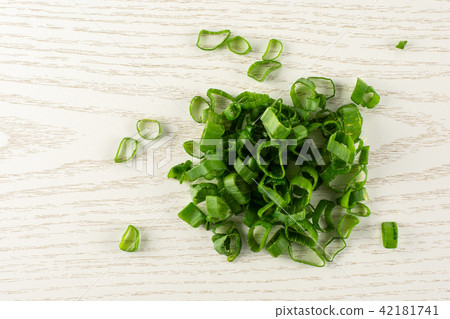 Fresh Raw green spring onion on grey wood Fresh Raw green spring onion on grey wood 42181741