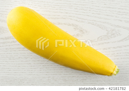 Fresh Raw yellow zucchini on grey wood Fresh Raw yellow zucchini on grey wood 42181782