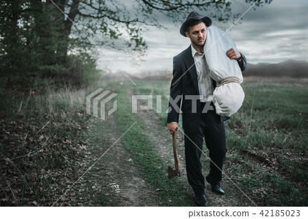 Murderer with an axe, serial maniac concept Murderer with an axe, serial maniac concept 42185023