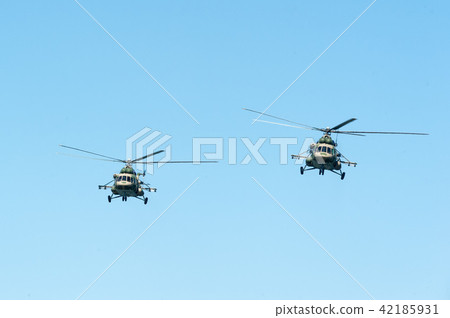 Russian military helicopter MI-8 in the cloudy sky Russian military helicopter MI-8 in the cloudy sky 42185931