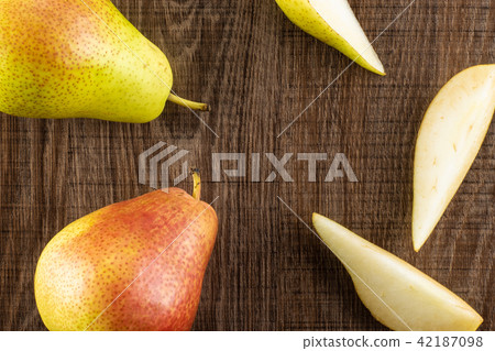 Fresh Raw red pear on brown wood 42187098