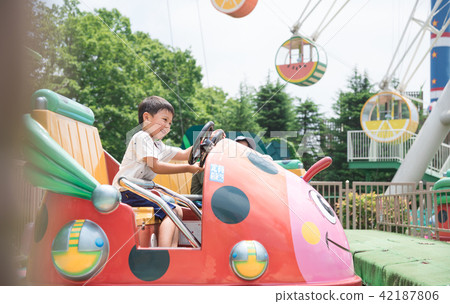 A child riding a vehicle 42187806