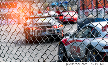 Motor sport car racing on asphalt road.  42191609