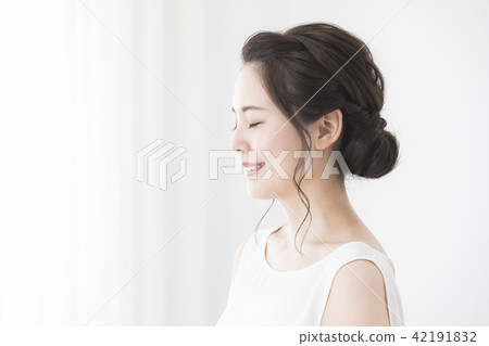 A woman by the window A woman by the window 42191832