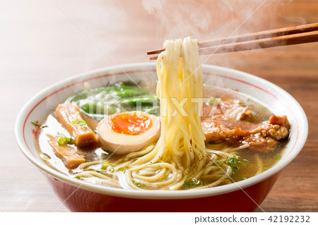 Picking hot soy sauce ramen with chopsticks Picking hot soy sauce ramen with chopsticks 42192232
