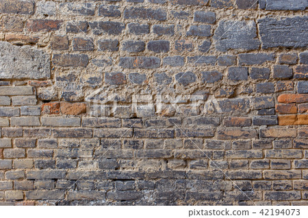 Ancient brick wall with different brick size 42194073