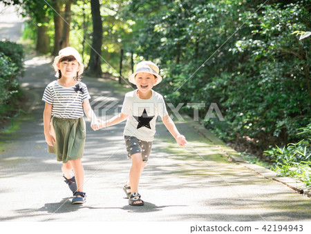 A child walking hand in hand A child walking hand in hand 42194943