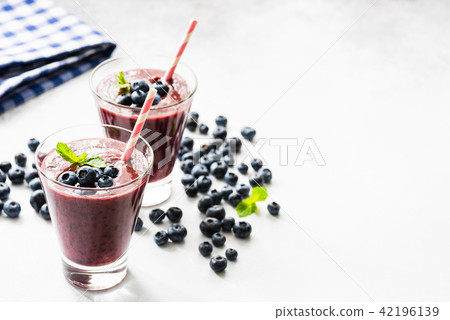 Acai blueberry smoothie in glass, isolated on white 42196139