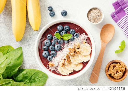 Acai smoothie bowl with blueberry, banana,walnut, coconut and chia seed 42196156