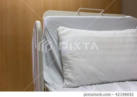 Modern and comfortable equipped empty bed. 42196692