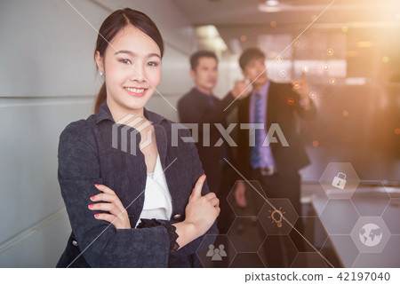 Smart businesswomen standing in office. Smart businesswomen standing in office. 42197040
