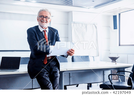 senior businessman working in office.  42197049
