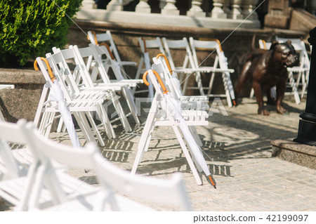 White chair with white umbrella. Wedding ceremony 42199097