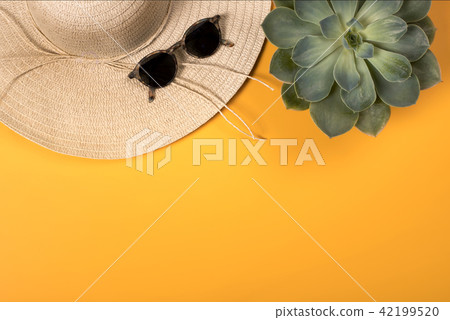 Colorful summer female fashion with hat on yellow background Colorful summer female fashion with hat on yellow background 42199520