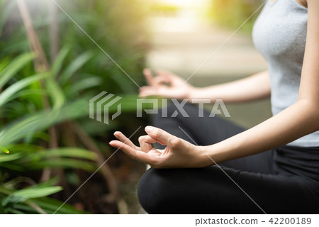 woman hands practicing yoga and meditation. woman hands practicing yoga and meditation. 42200189