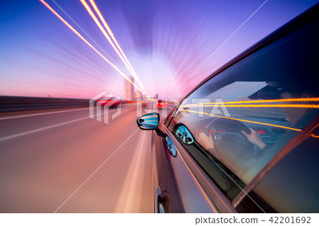 View from Side of Car moving in a night city View from Side of Car moving in a night city 42201692