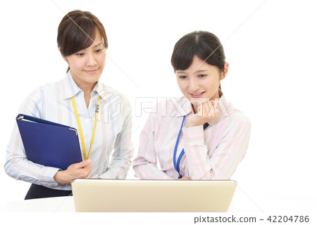 Two smiling business women Two smiling business women 42204786