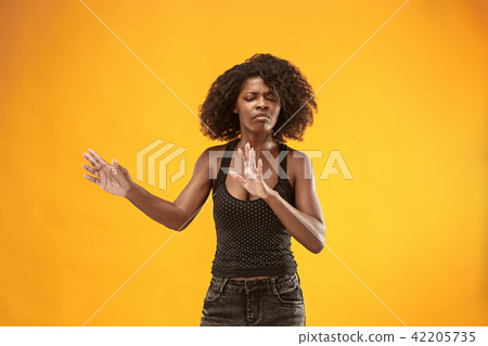 Let me think. Doubtful pensive woman with thoughtful expression making choice against pink Let me think. Doubtful pensive woman with thoughtful expression making choice against pink 42205735