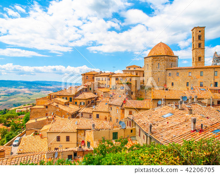Panoramic view of Volterra - medieval Tuscan town with old houses, towers and churches, Tuscany Panoramic view of Volterra - medieval Tuscan town with old houses, towers and churches, Tuscany 42206705