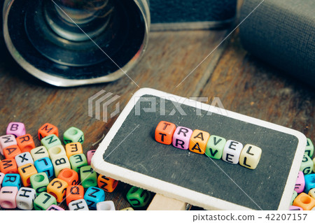 TRAVEL word block on wooden signage 42207157