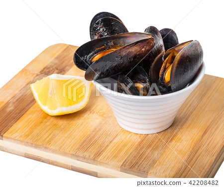 cooked mussels in a bowl with lemon cooked mussels in a bowl with lemon 42208482