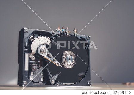 Workers having a break on top of giant HDD 42209160