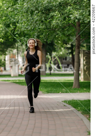 young attractive woman running young attractive woman running 42209667