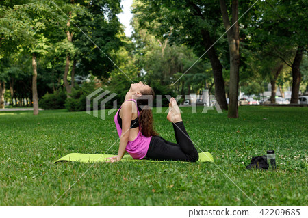 woman doing stretching exercises woman doing stretching exercises 42209685